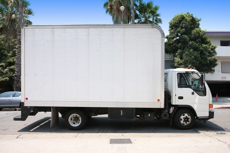 White delivery truck in suburban street
