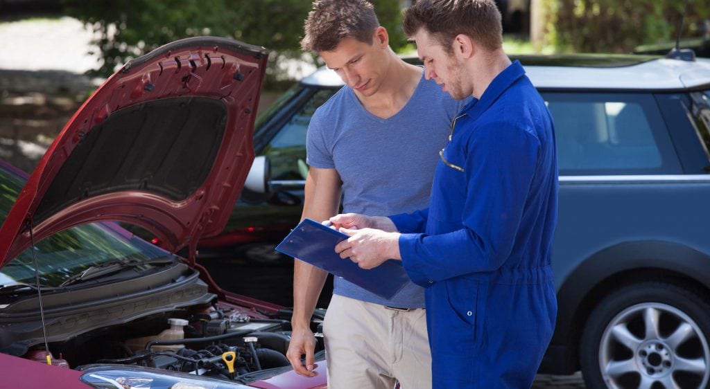 Mechanic doing customer service simple explanation